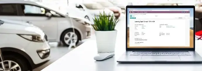 Odoo Fleet management system displayed on laptop for tracking vehicle contracts and operational details