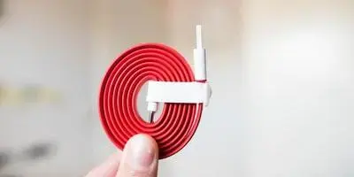 USB cable connected to Odoo IoT device for hardware integration